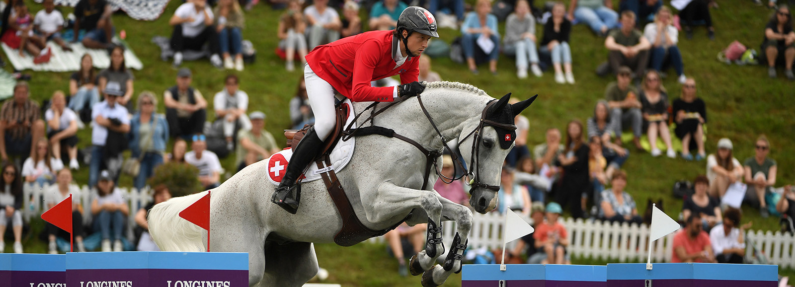 Longines FEI Jumping Nations Cup™ 2022 St Gallen, Switzerland MARTIN FUCHS of Switzerland on LEONE JEI tackles the opening jump in the Longines FEI Jumping Nations Cup of Switzerland in St Gallen, Switzerland, June 6, 2022.